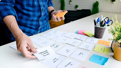 Planning a website project with sticky notes on a desk